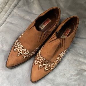 A vintage pair of low suede leopard boots